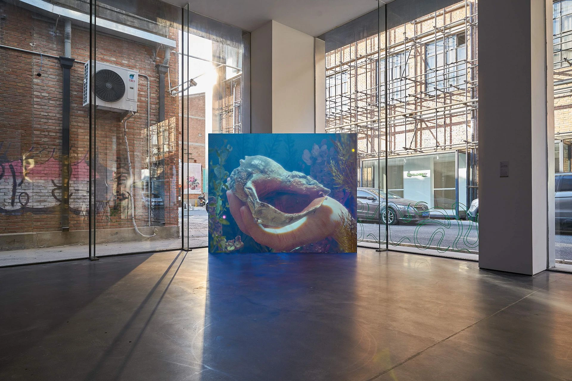 Installation view of Hominins (2019) by Wu ChiYu, a single-channel video work displayed on a large screen inside a gallery space at Macalline Art Center.