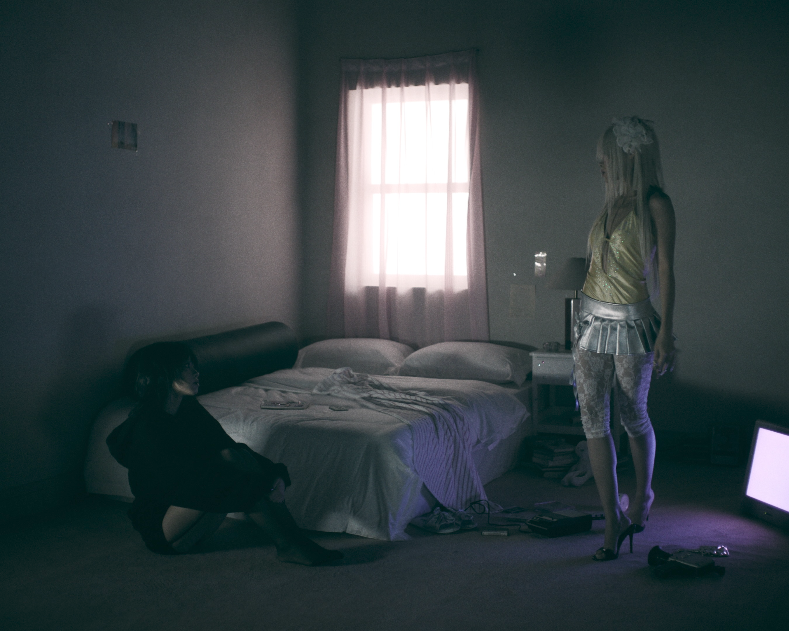 Scene from Pop Girl music video by Lexie Liu, directed by Aaron Deng, dim motel room