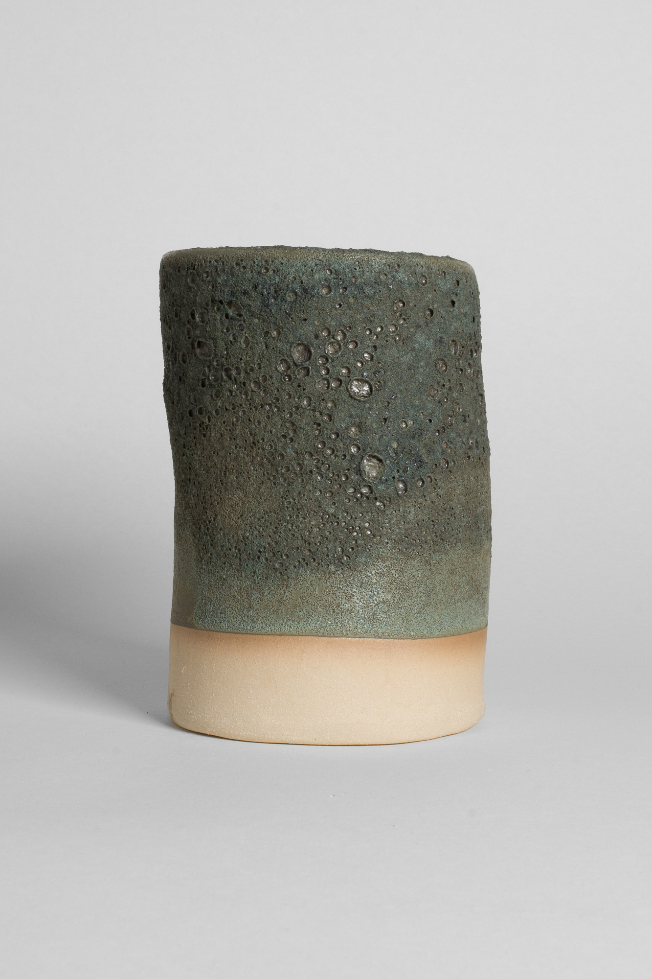 GLOST Glaze London handmade ceramic vessel with textured volcanic green glaze and unglazed base