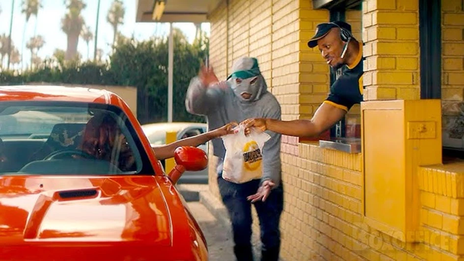 Chicken Bandit in ski mask intercepting Church's Texas Chicken bag at drive-thru window, Sony Pictures promotional still