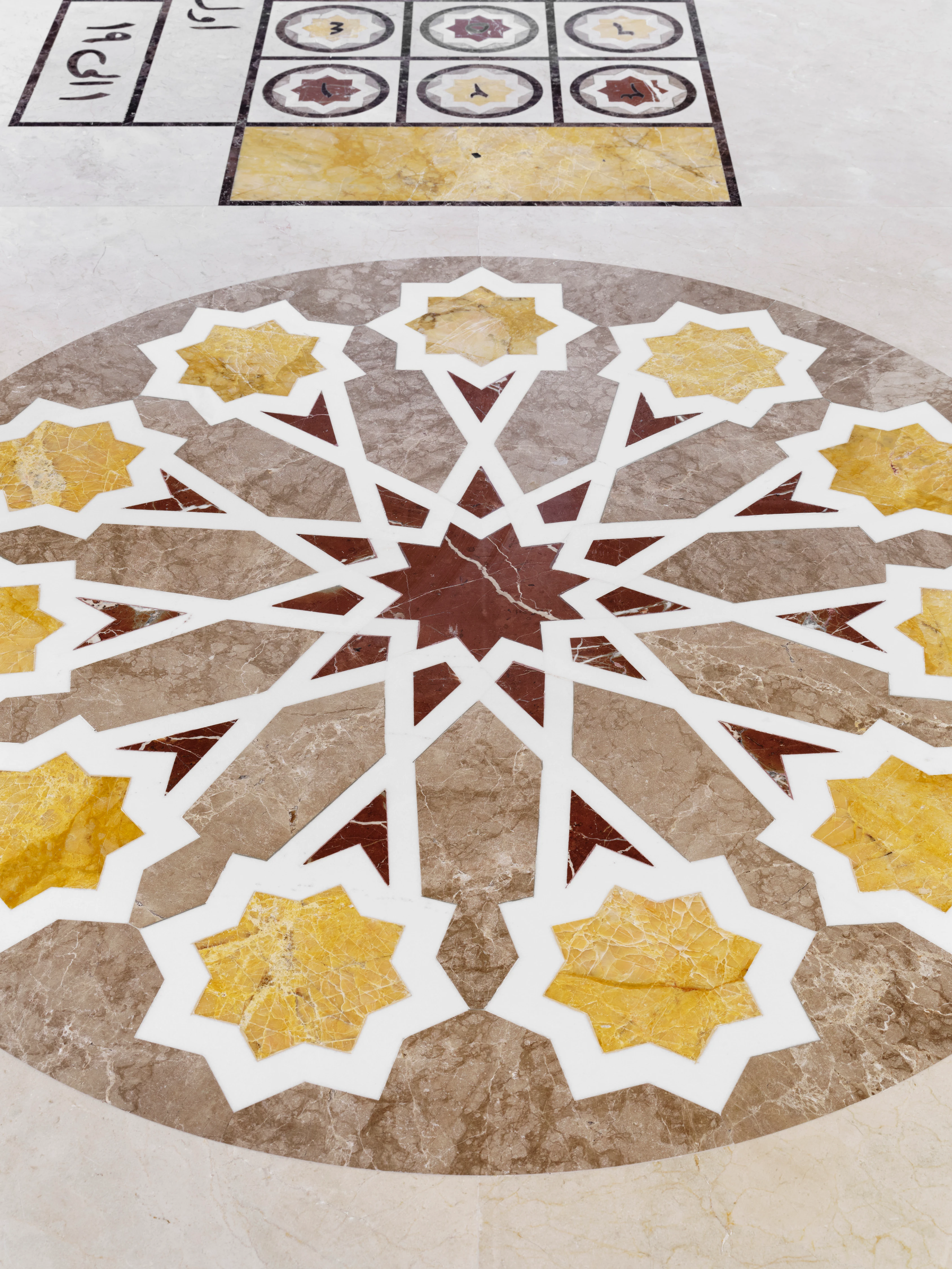 Marble inlaid floor medallion with geometric star pattern, Arabic Roulette Table by Oud Casino, ASBAR 2026