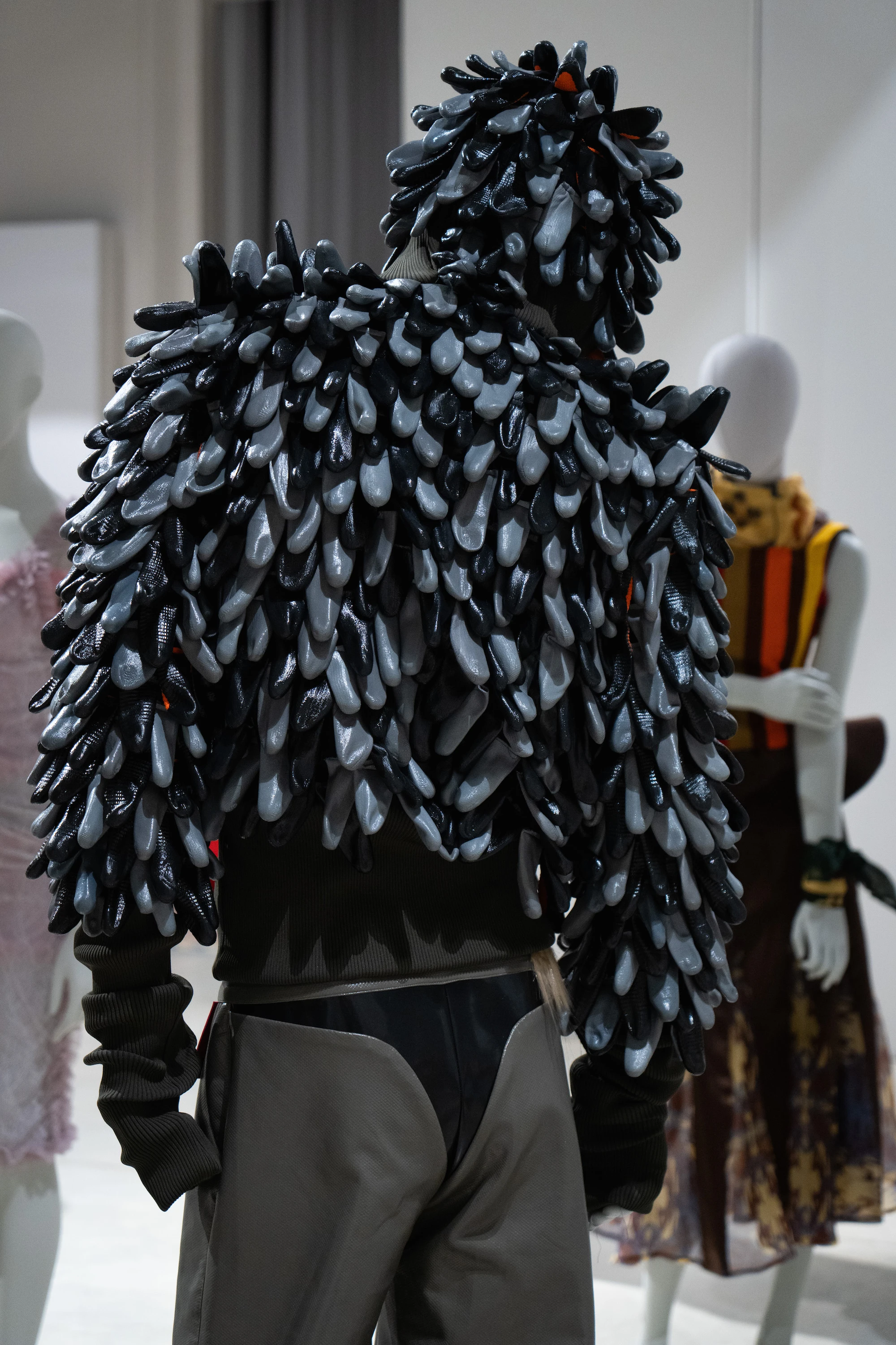Sculptural black mussel-shell jacket and hat from Alessandro Paolucci's IED Milan UNFOLD 2026 graduate collection