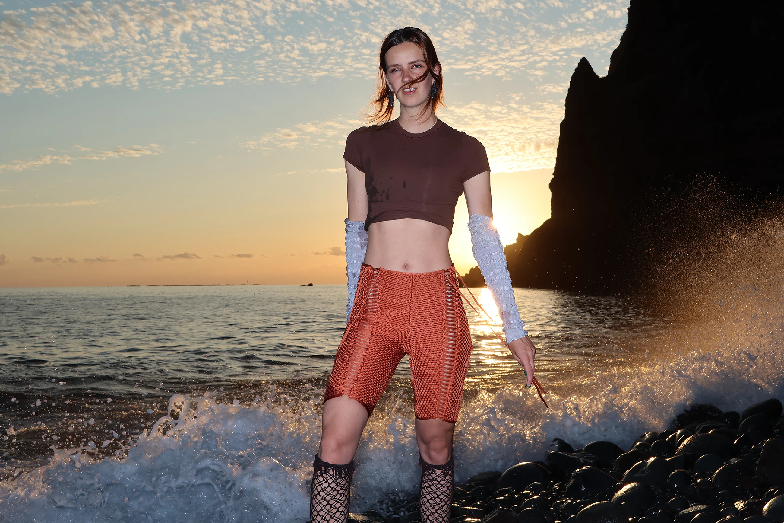 Irene de Boer standing on rocky shoreline