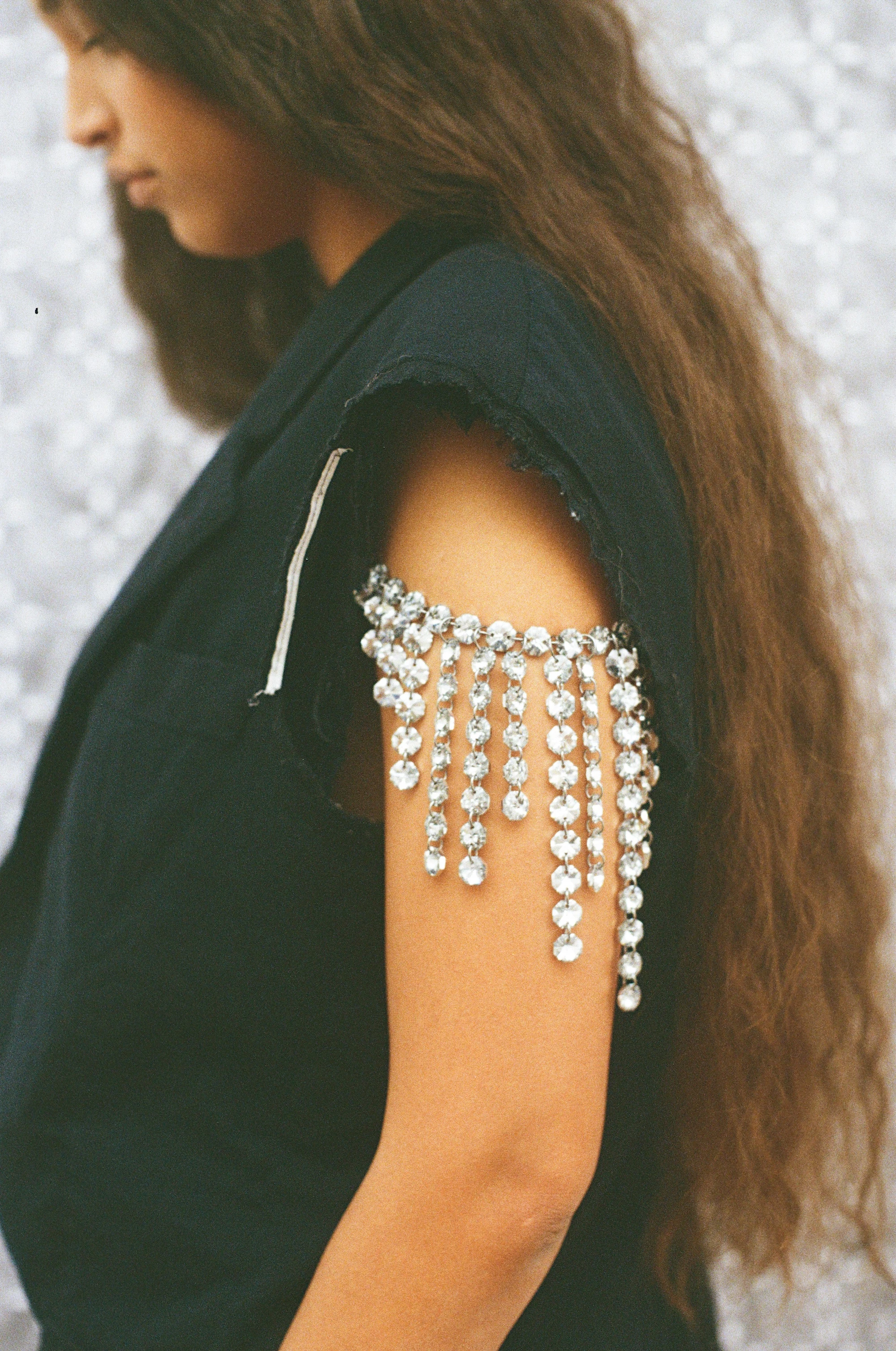Maria Calderara F/W 26 crystal rhinestone fringe shoulder embellishment on black sleeveless top, WWWWOMANWORDWRITING collection