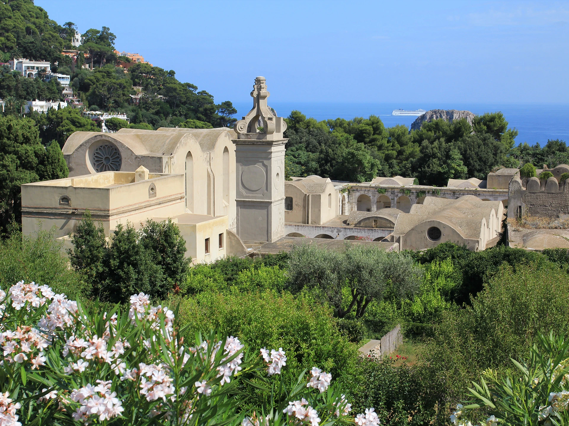 Capri Archaeological Museum historic stone building surrounded by lush gardens with Mediterranean sea views