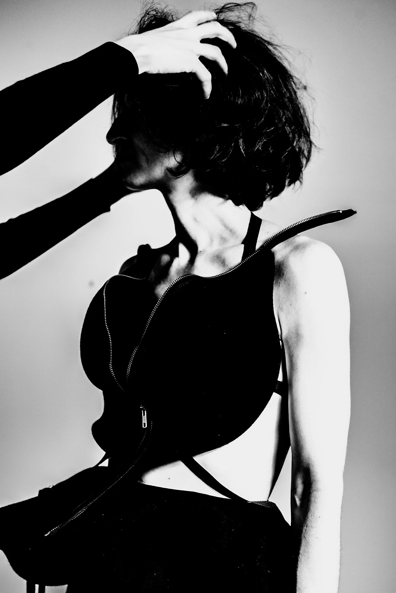 DZHUS ABSOLUTE-124 black architectural harness top editorial fashion monochrome portrait with dramatic shadows