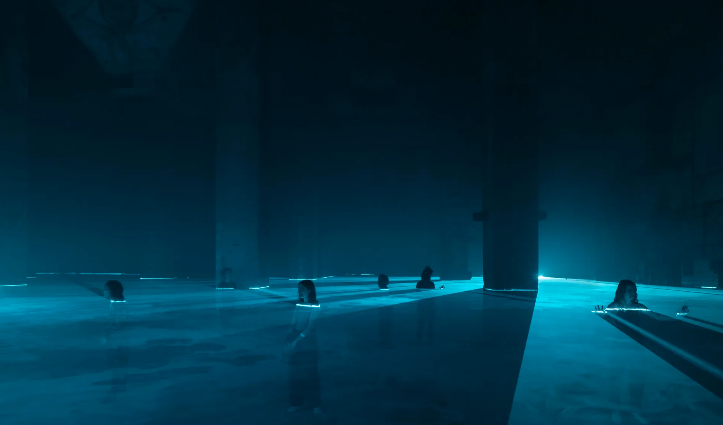Ian Cheng Life After Bob installation at Halle am Berghain Berlin 2022, dark hall with cyan neon light strips