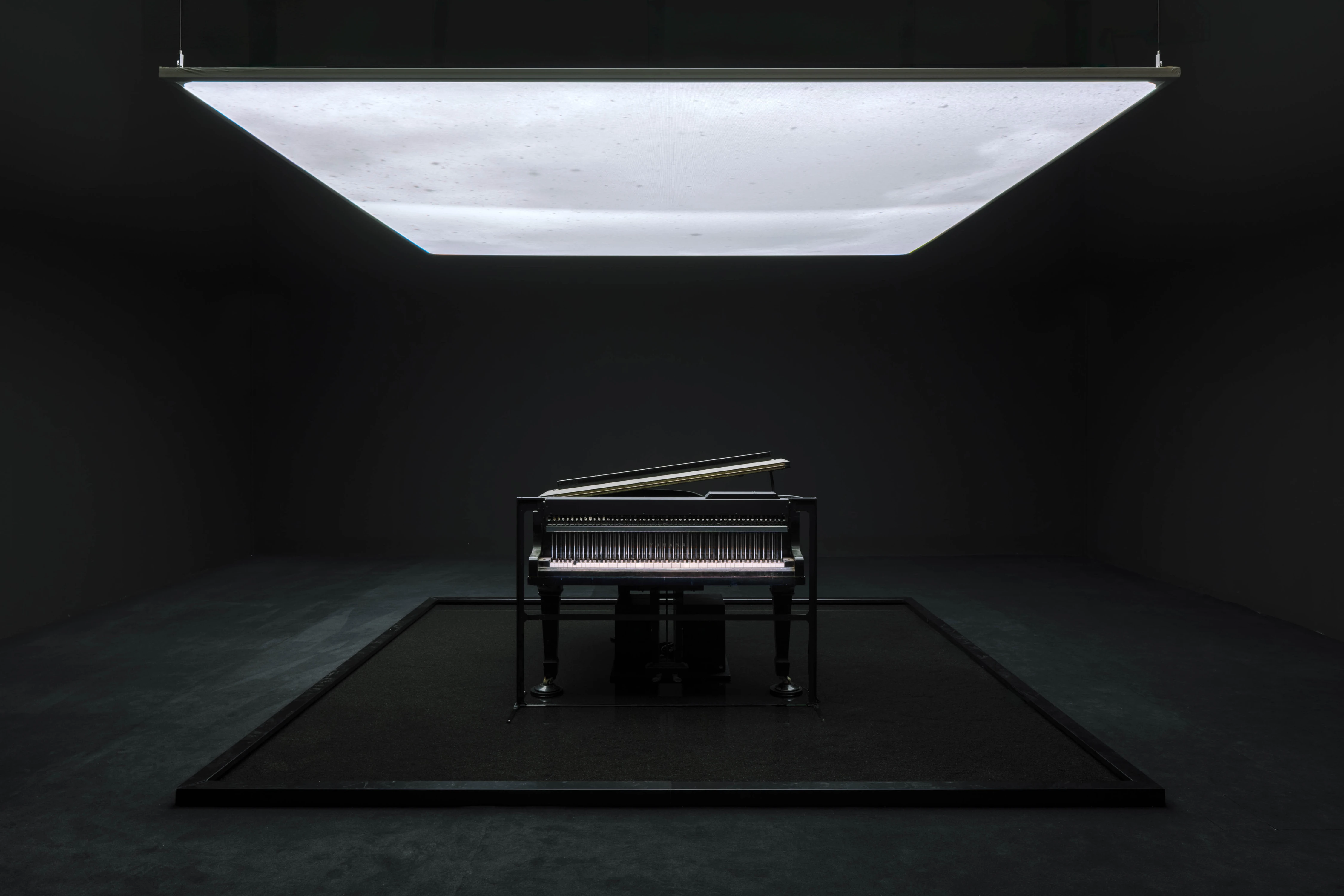 Ryuichi Sakamoto 'IS YOUR TIME' installation, grand piano under luminous ceiling panel, Hamburger Bahnhof 2026