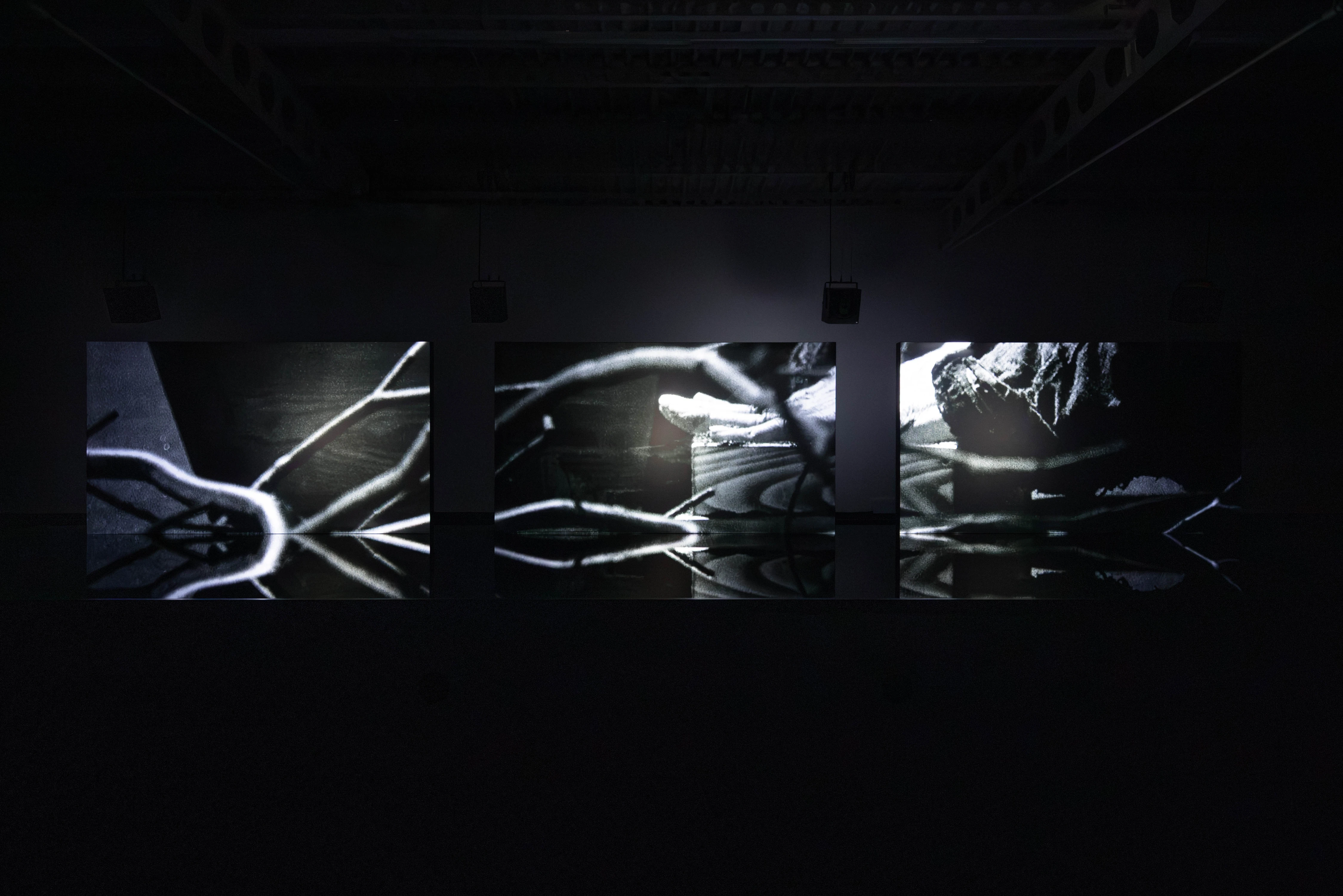 Ryuichi Sakamoto and Shiro Takatani's TIME TIME video triptych installation at Hamburger Bahnhof, black-and-white projections on three screens