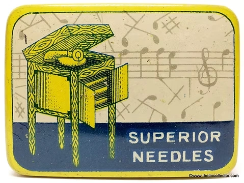 Vintage yellow and blue tin box illustrated with a wind-up gramophone cabinet and musical notes, labeled