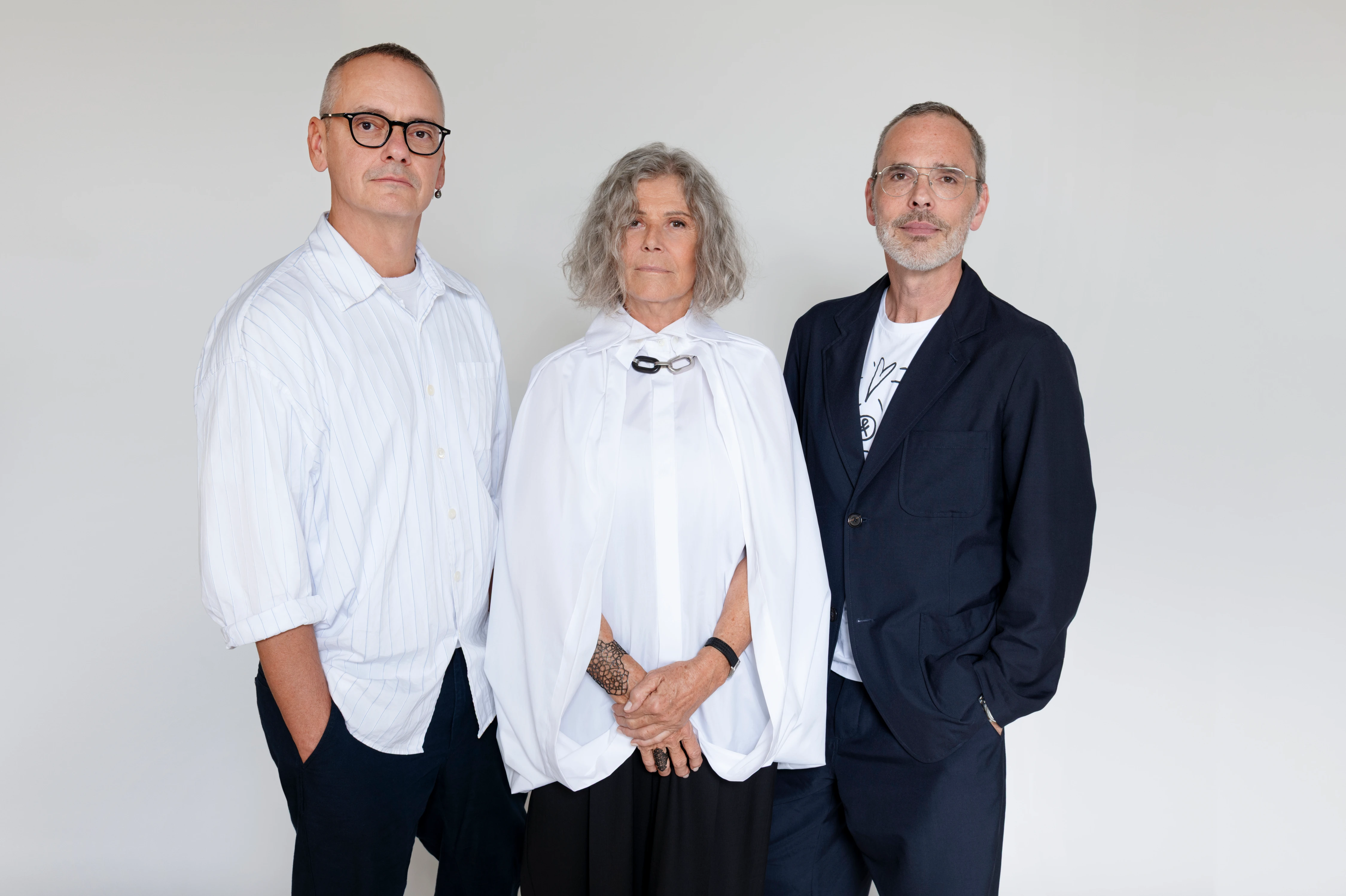 Tiziana Fausti with Viktor&Rolf designers, styled in white and navy, photographed by Stefano Guindani