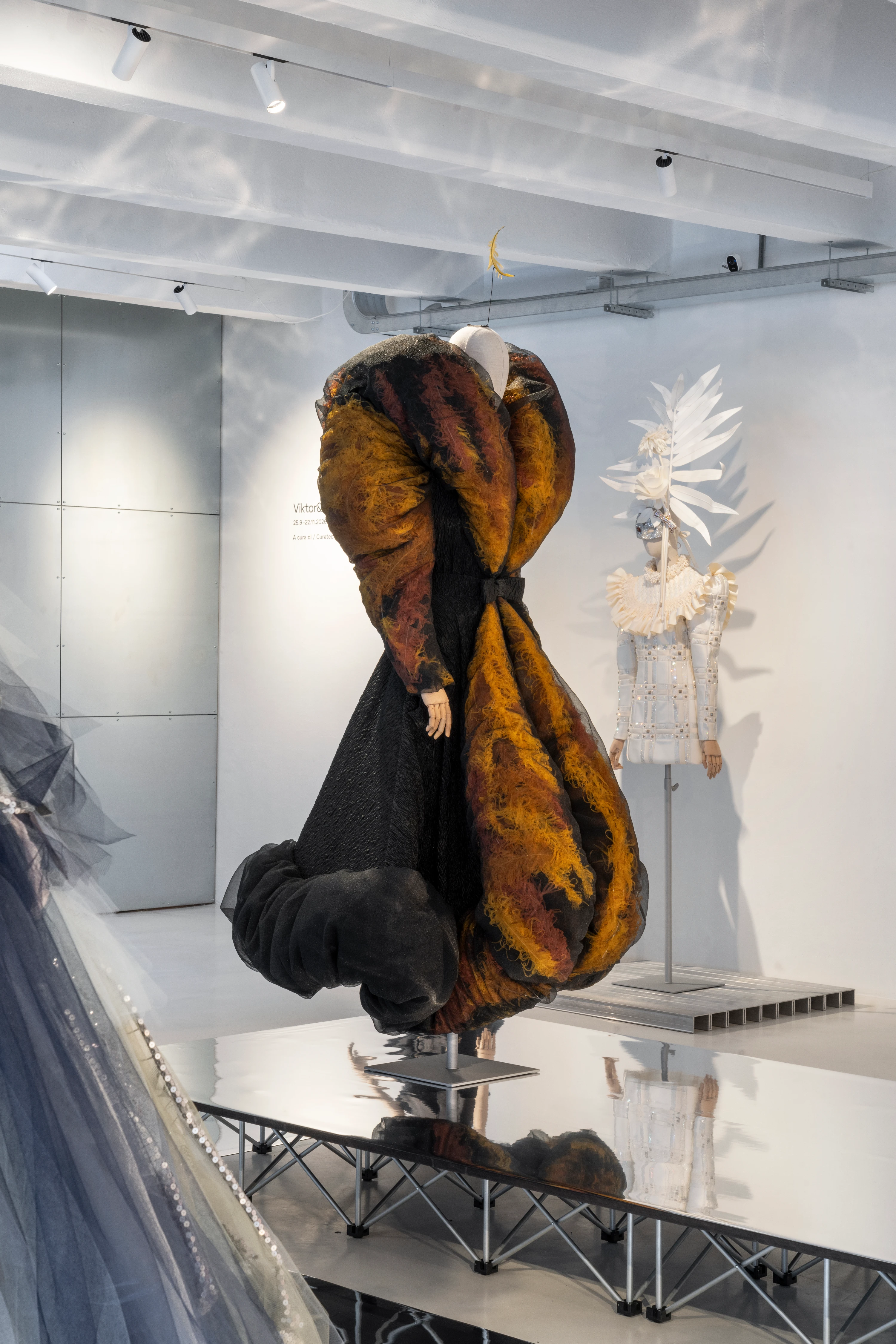 Viktor&Rolf Spectrum installation at 10 Corso Como Milan, sculptural gown with dramatic rust-black voluminous silhouette on mannequin