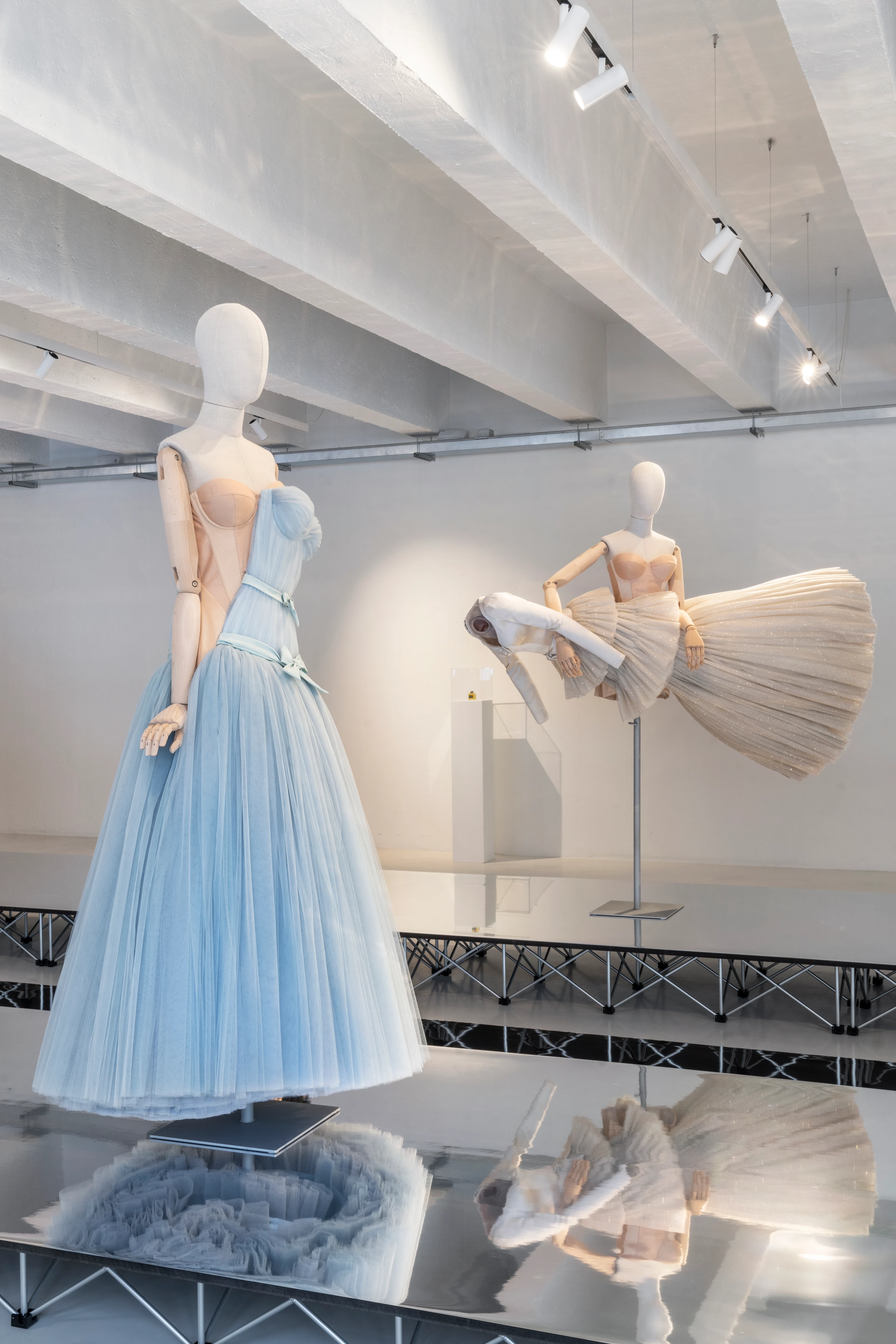 Viktor&Rolf Spectrum installation at 10 Corso Como Milan featuring light blue tulle gown and sculptural fan skirt on articulated mannequins