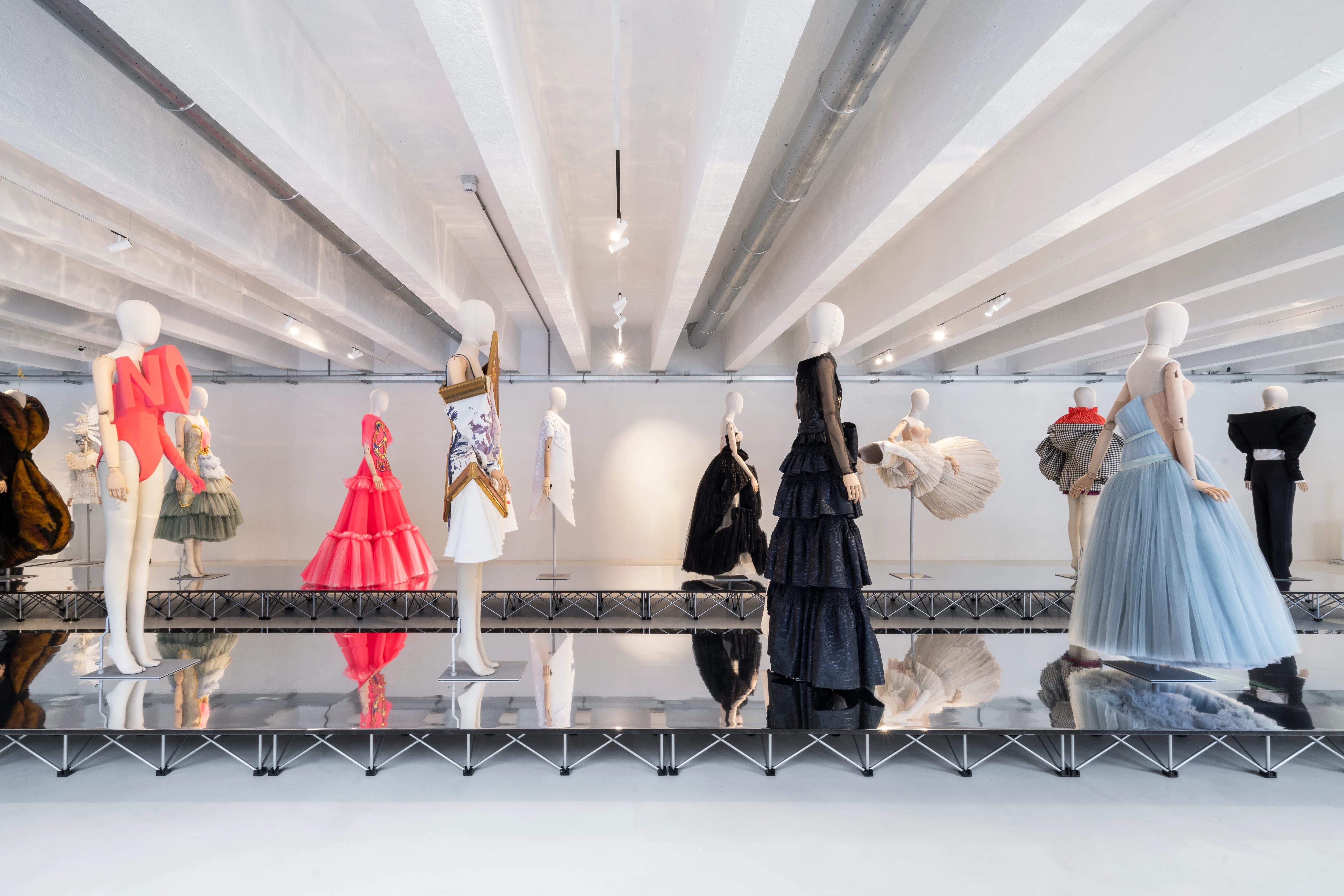 Viktor&Rolf Spectrum fashion installation at 10 Corso Como Milan, mannequins in dramatic couture gowns on mirrored platform